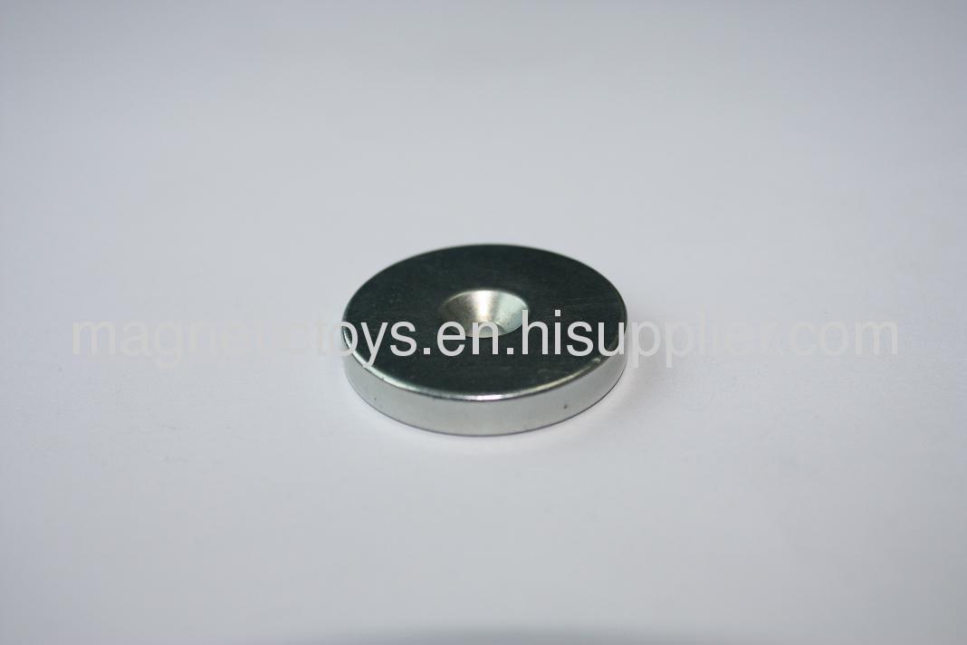 Sintered NdFeB magnet with taper hole