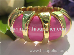Cross blue stone color plastic bracelet