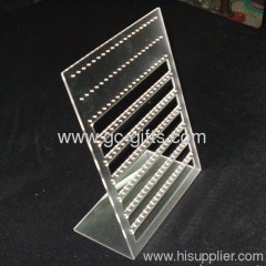 Transparent L-shaped lucite jewelry holder