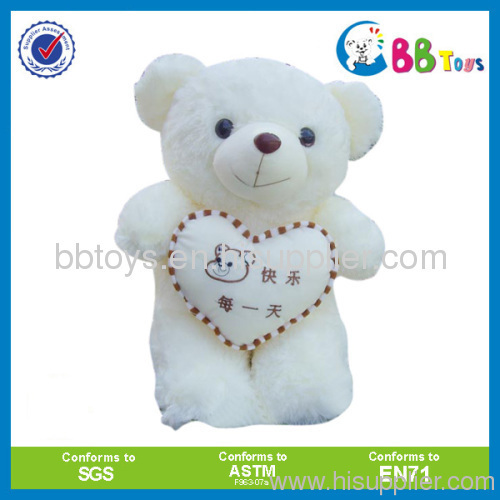 lovely teddy bear holding a heart