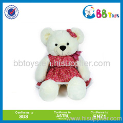 cute teddy bear in red skirt