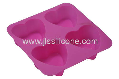 Silicone muffin or jelly or chocolate baking pan in pink heart shape