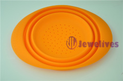 Orange Food safe Silicone steamer, foldable silicone pot