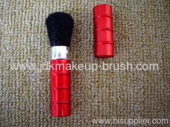 red retractable powder brush