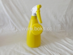 yellow plastic watering can