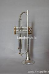 gold and silver professional trumpet