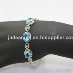 Fashion Jewelry 9x11mm Oval Cut Created Blue Topaz and Clear Cubic Zircon Link Bracelet