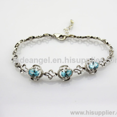 Fashion Jewelry 925 Silver Link Bracelet with 5x7mm Created Blue Topaz and Clear CZ Diamonds