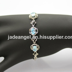 Fashion Jewelry 925 Silver Link Bracelet with 5x7mm Created Blue Topaz and Clear CZ Diamonds