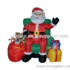 5 Foot Musical Animated Inflatable Santa Claus in Green Sofa
