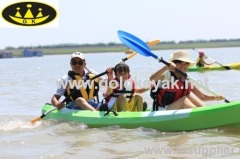 three person sit on top kayak fishing