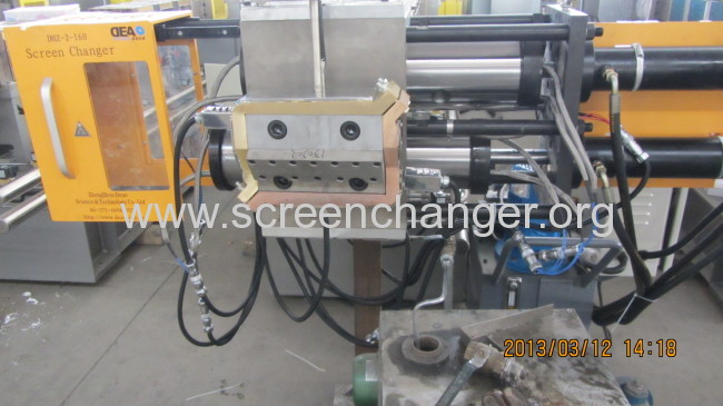 Double pillar continuous screen changer/melt filter