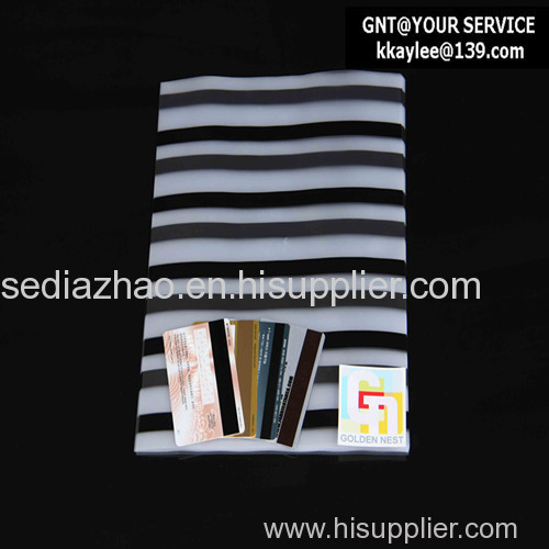 Magnetic stripe coated overlay