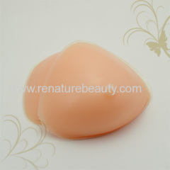 Strapped triangular silicone breast for cross dresser