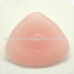 Strapped triangular silicone breast for cross dresser