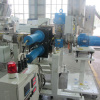 Double piston continuous screen changer for plastic extrusion machine