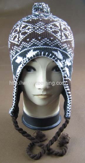 Snow flower jacquard hat with earflap and pompon,overlock on the edge