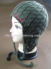 Cable needle earflap hat with part of fleece lining