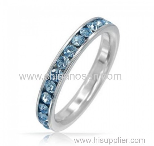 Fashion band ring with blue topaz element