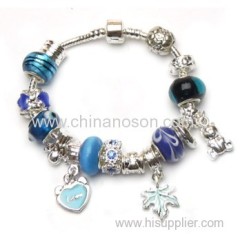 Sapphire metal bracelet with heart and flower pendant