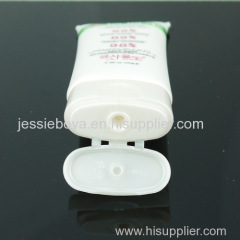 Shiny plastic tube for hand cream with oval flip top cap