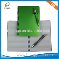 spiral notebook with pen