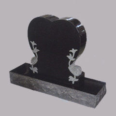 Granite gravestones with flowers and birds engraving