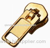 Accessory zipper pull for the garment handbag and wallet
