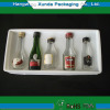 Plastic cavity packaging tray for wine bottles