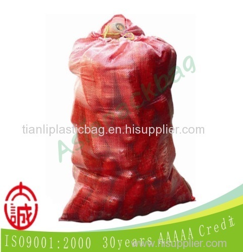 red transparent woven bag sacks for potatos, carrots