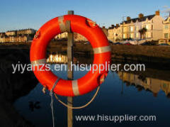 life buoy with self-igniting light and self-activating smock signals