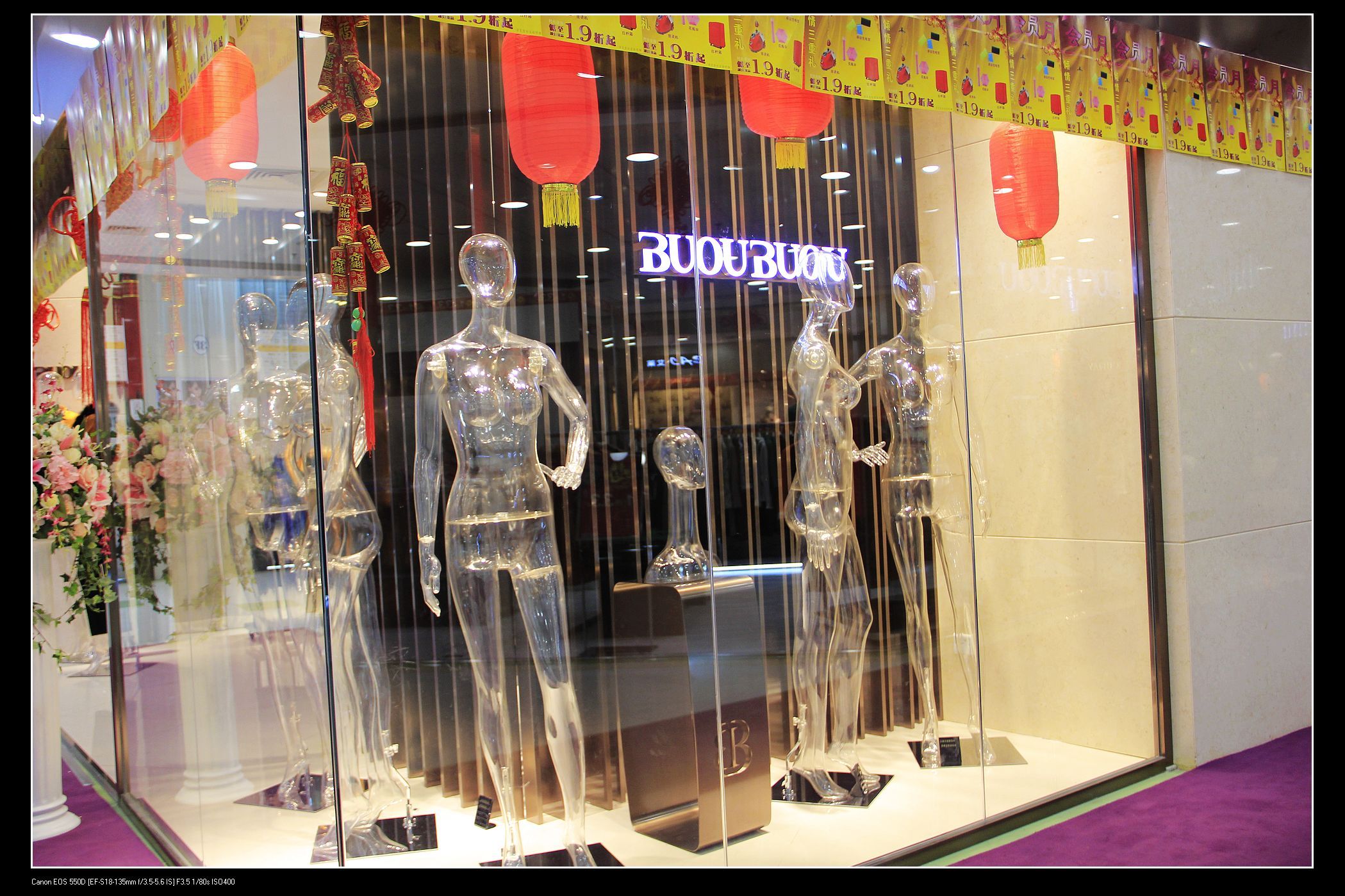 Transparent full body mannequin in shopwindow