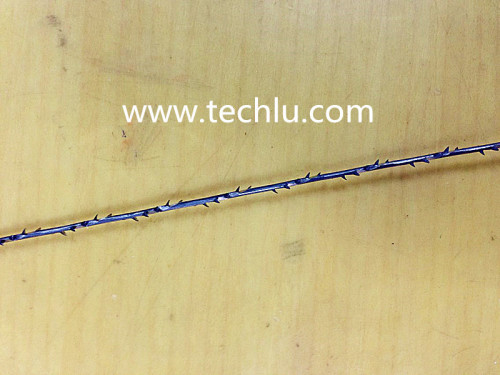 Flexible spiral edge hacksaw blade