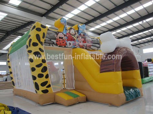 The Stone Age Inflatable Castle with Slide