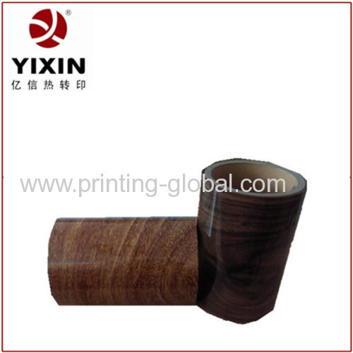 Heat transfer film of wood grain print on flat surface of wooden furniture