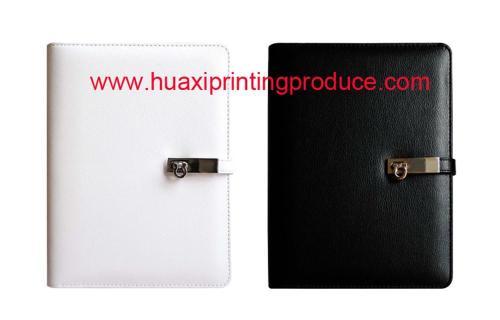 white black leathery note books with a lock