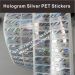 Stamped hologram labels on pet vinyl labels