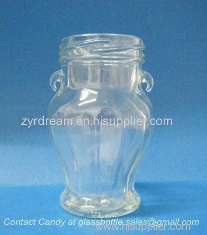 empty glass honey jar