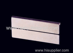 Sintered permanent magnet strip magnet