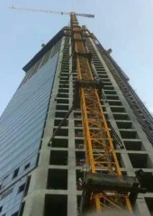 red/yellow/blue building construction tower crane