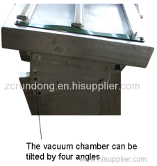 Tilt adjustable vacuum packaging machine