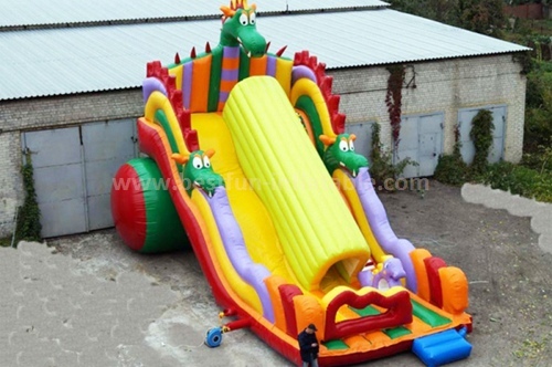 Inflatable obstacle course slide