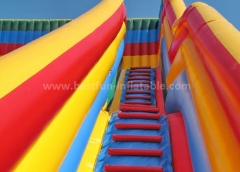 Inflatable slide with arch