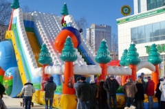 Inflatable trampoline with slide