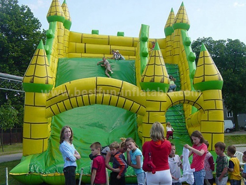 Large inflatable green slide