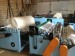 Automatic rewinding and perforating paper machine