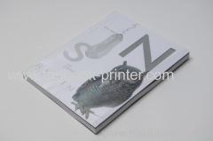 custom 250gsm art paper cover perfect bound backless softcover or softback book with silver stamped PVC dust jacket