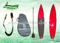 round bottom red Joe Bark racing paddle boards in open ocean