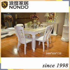 Ivory dining room designs with marble top tables