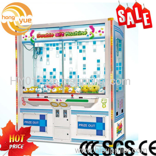 Coin operated toy grabbing game machine double luxury doll gift machine